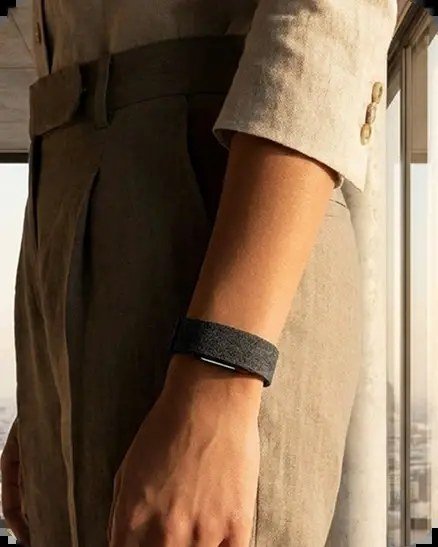 Hume Band worn on the wrist beneath a linen sleeve — metabolic capacity tracking during everyday life